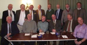 Quiz Master Norman Topliss, Center, with Downham Market team seated, and 
March team standing to the rear 

